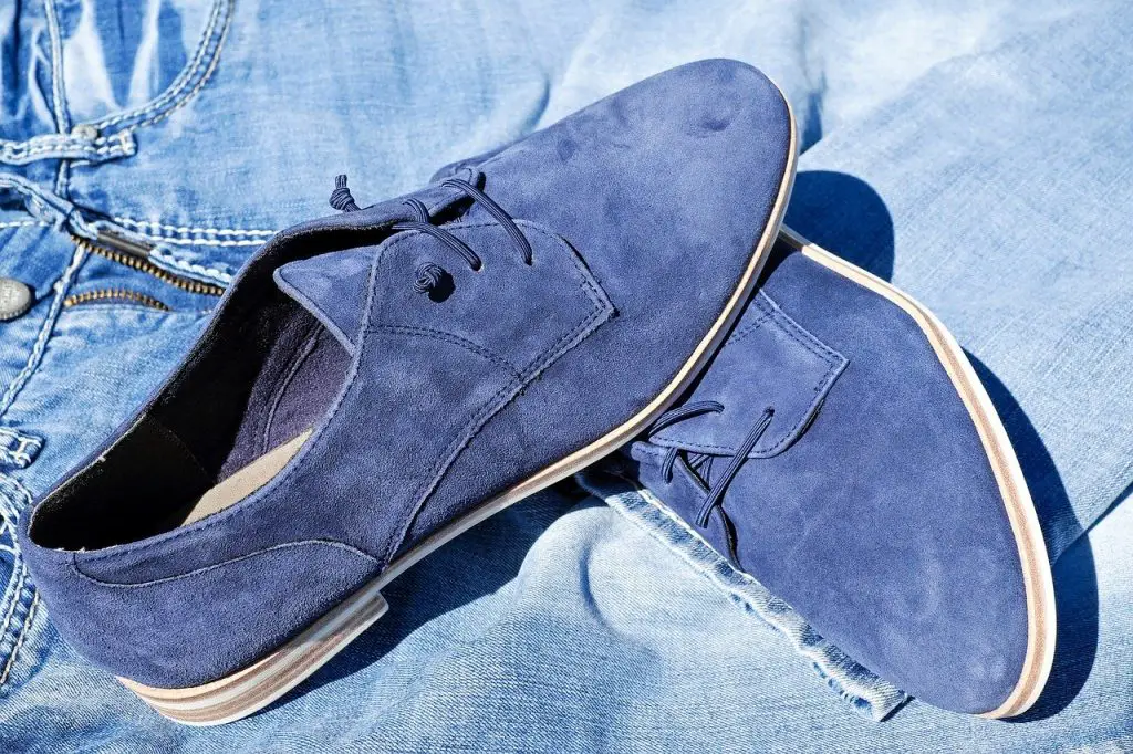 blue pair of suede shoes