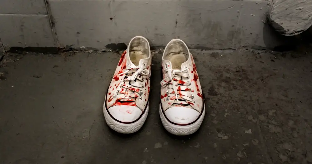 fake blood stains on white canvas shoes