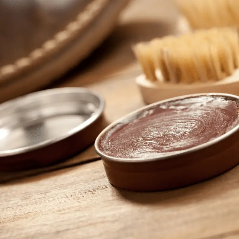 leather conditioner for boots on table with brush