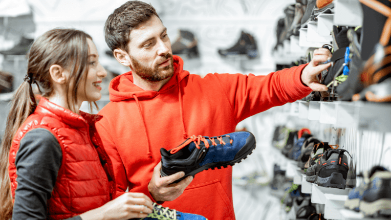 Man and woman shopping for shoes