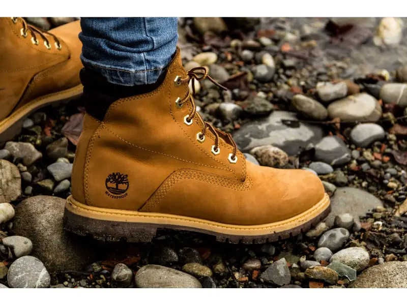 Up close shot wearing Timberlands in a wet creek bed.